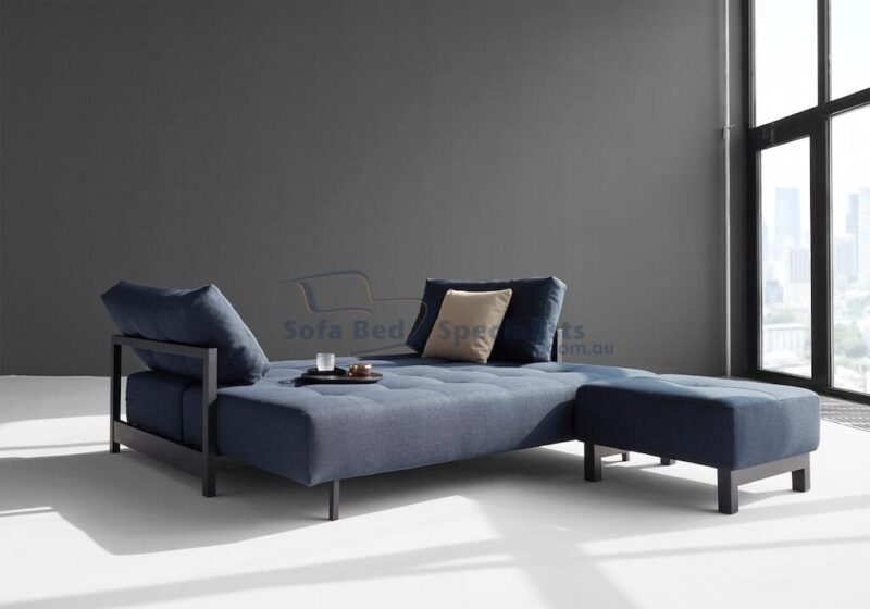 Sophia Sofa Bed next to matching Pouf opened up in a Grey Room with a big window